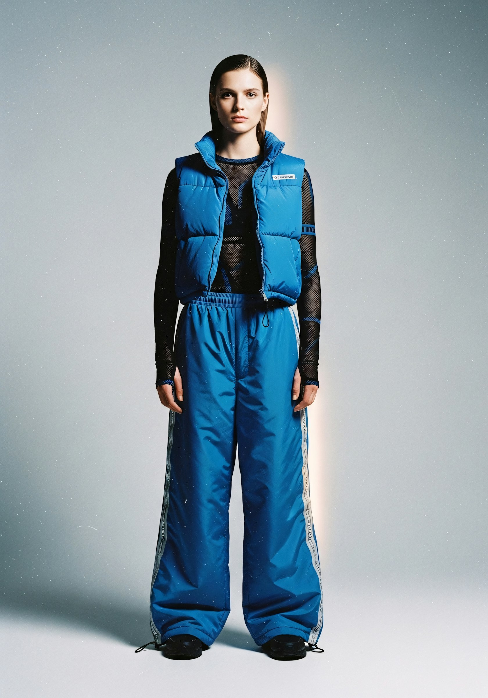 Static Track Suit — Zip-through track top and pant in a static-charge sheen.
